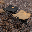 a black and white suitcase sitting on the ground