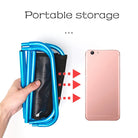 a person holding a cell phone in their hand