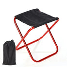 a red and black umbrella sitting on top of a table