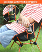 a person sitting on a chair with a dog on a leash 