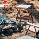 a chair that is sitting in the sand 