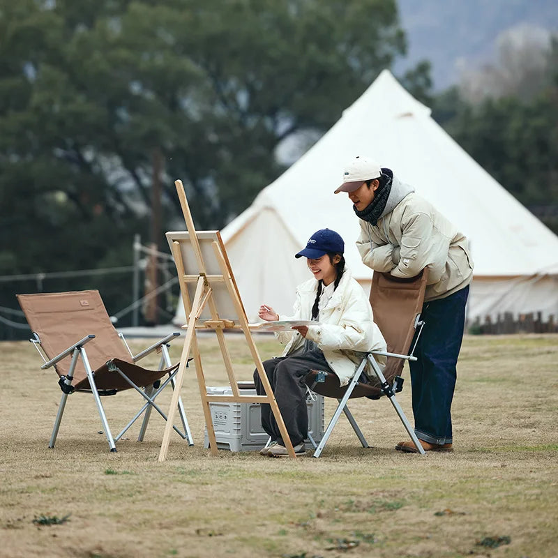 Chaise pliante de camping NATUREHIKE ultra-confortable amusement devant une tente - LeCoinChaise