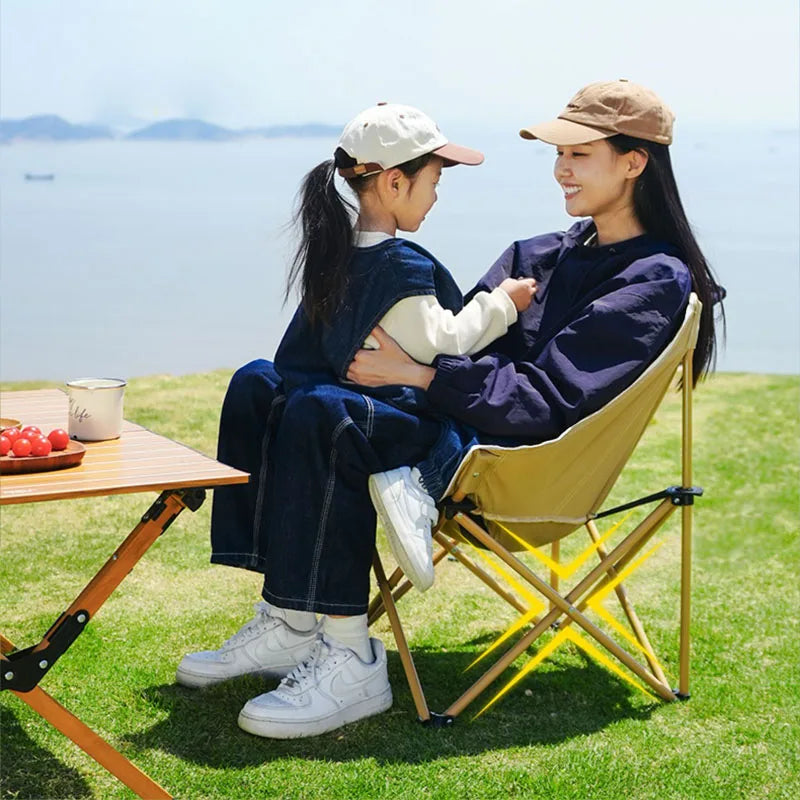 a couple of people sitting on a park bench 